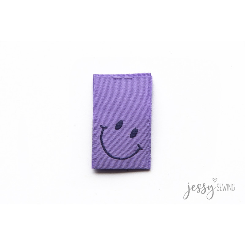 Étiquette tissée - Sourire violet Étiquette tissée - Sourire violet