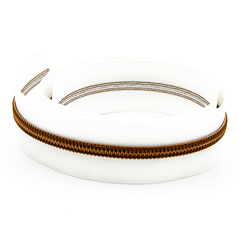 Endless zipper YKK 6mm metal white/antique brass