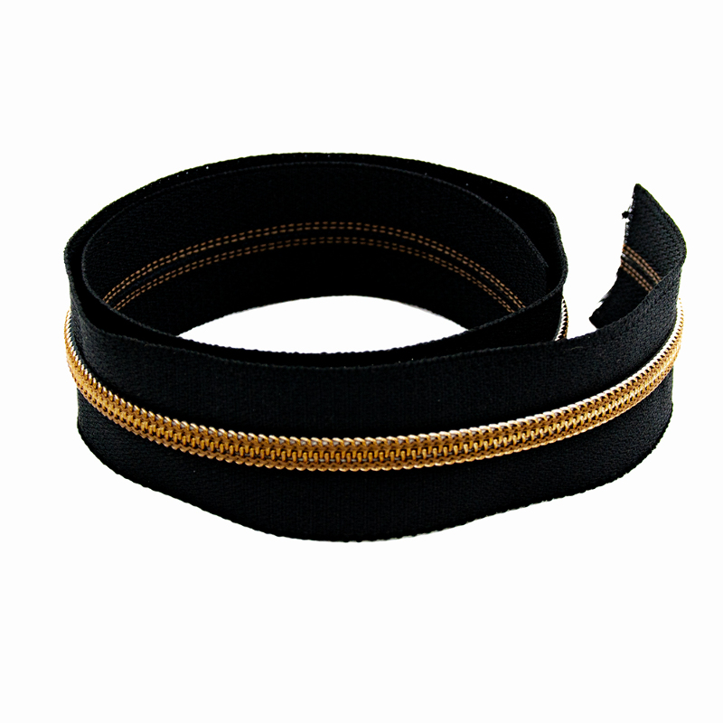 Endless zipper YKK 6mm metal black/antique brass